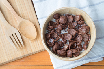 Bowl of chocolate flakes with milk for breakfast