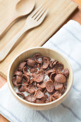 Bowl of chocolate flakes with milk for breakfast