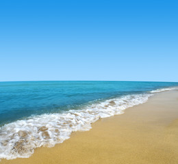 Fototapeta na wymiar Blue sea and sky with sandy beach.