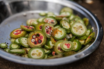 Wild uncultivated fruits for a curry. Indigenous Adivasi women collect those fruits in the forests of Jharkhand, India.