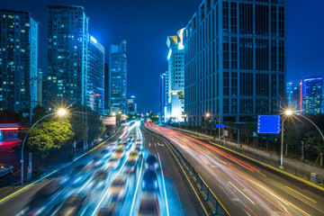 Fototapeta na wymiar night view of urban traffic with cityscape in Shanghai,China.