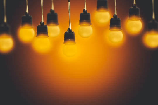 Light bulbs on a warm gradient background