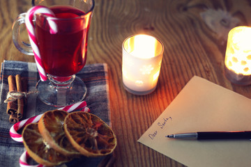 Christmas letter on the table with spices