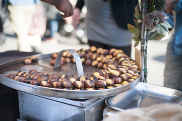 Kitchen pan and many roast chestnuts