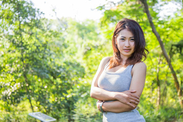 Beautiful young woman  is in the green forest