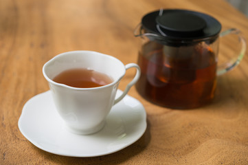 Cup of tea on wooden table. shallow depth of field