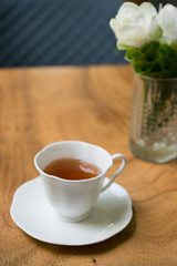 Cup of tea on wooden table. shallow depth of field