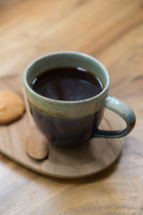 Americano black coffee on a wooden table. shallow depth of field