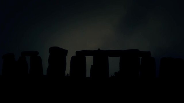 Stonehenge Silhouette at Night Under a Lightning Storm and Rain