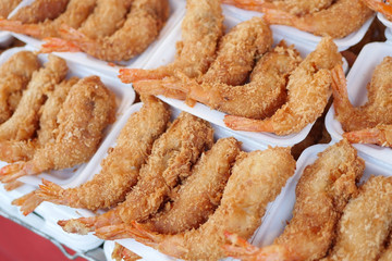fried shrimp in styrofoam plate