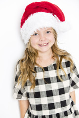 Happy christmas girl in Santa hat on white background