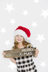 Happy christmas girl in Santa hat on white background