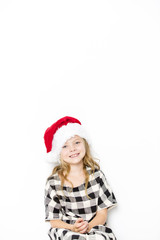 Happy christmas girl in Santa hat on white background