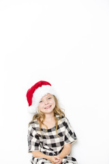 Happy christmas girl in Santa hat on white background
