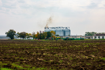 Fototapeta na wymiar Agricultural warehouse outdoor landscape at autumn
