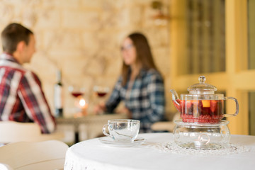Couple of young people in the restaurant for a glass of wine.