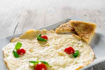 English Omelette with Tomatoes on Table