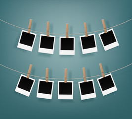 Set of Wooden Clothespins Pegs whith Blank Retro Photo Frames on Rope Close up Isolated on Background