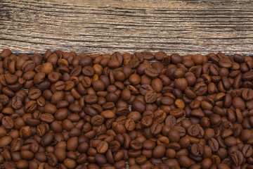 0062-0000001006........0062-0000001007
coffee beans on wooden background