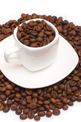 small white cup with coffee beans, isolated white background
