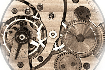 Old soviet pocket watch mechanism in sepia