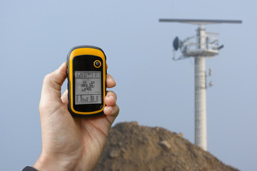 finding the right position inside a construction site via gps (blurred background)