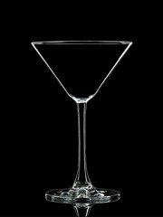 Silhouette of white martini glass with clipping path on black background.