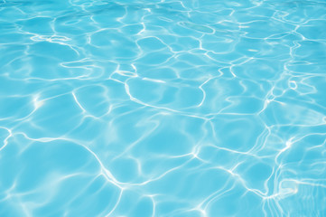 Naklejka na ściany i meble Beautiful blue water surface in swimming pool