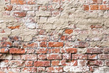 Texture of old rustic brick wall painted with white