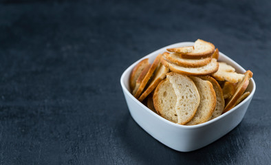 Bread chips on a slate slab