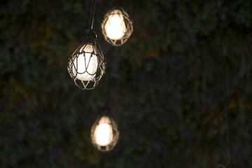 Lighting candles or false The suspended ceiling made of flowers.
