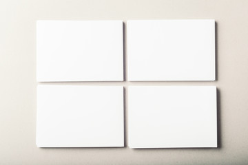 blank business cards on grey background