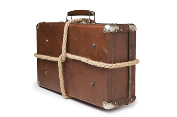 old suitcases tied with rope