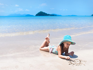 girl playing on the beach