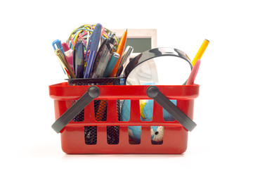 Multiple office tools in a shopping cart, isolated on white background