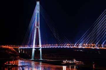 night view of the longest cable-stayed bridge in the world in the Russian Vladivostok over the Eastern Bosphorus strait to the Russky Island