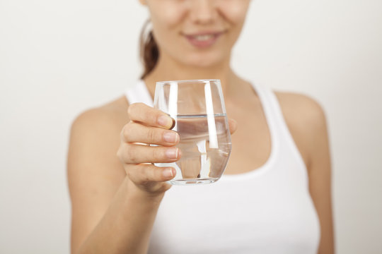 Young woman drinking  glass of water