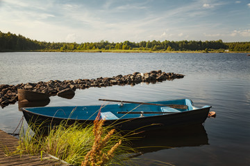 Naklejka na ściany i meble Row boat by lake