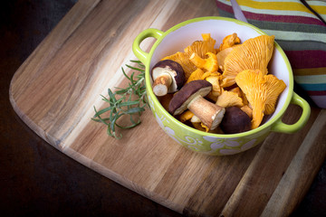 Bowl with cantharellus. Yellow chanterelle and boletus