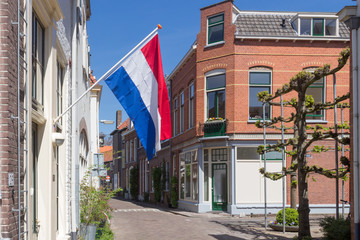 Fototapeta na wymiar Dutch flag in a street