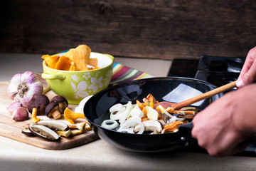 Frying pan with boletus, chanterelle and onion