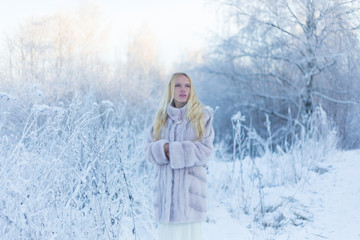 Fototapeta na wymiar Model in winter forest