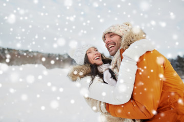 happy couple hugging outdoors in winter - Powered by Adobe