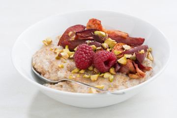 oatmeal with baked fruit and pistachios for breakfast 