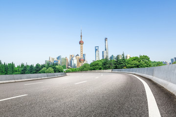 Fototapeta na wymiar Shanghai skyscraper city scenery and new asphalt road in China