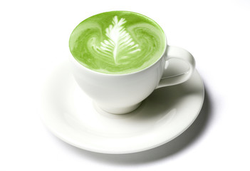 cup of matcha green tea latte over white