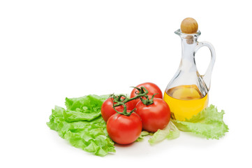 Tomato, lettuce salad and jug of vegetable oil isolated