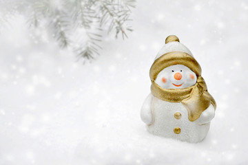 Christmas card with Snowman figurine holding Christmas star. Christmas background concept with copy space