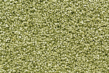 Yellow wall covering with smal lstones