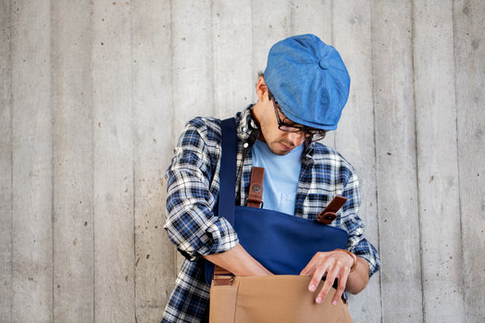 Hipster Man Looking For Something In His Bag